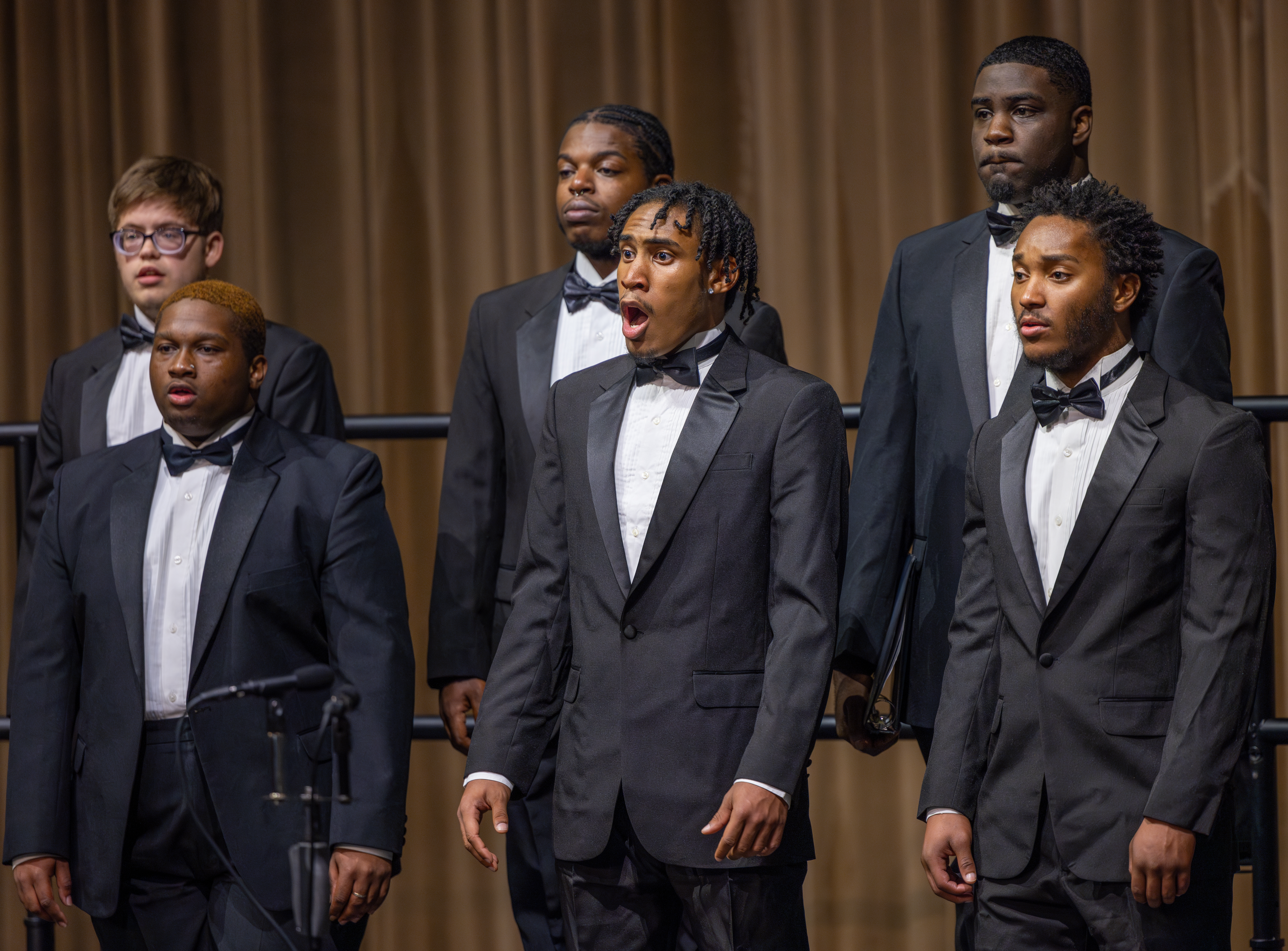 Choir in mid-performance, close-up of singers